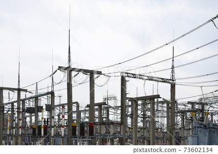 Power plant is a station of transformation. A lot of cables, poles and wires, transformers. Electro-energy. 73602134