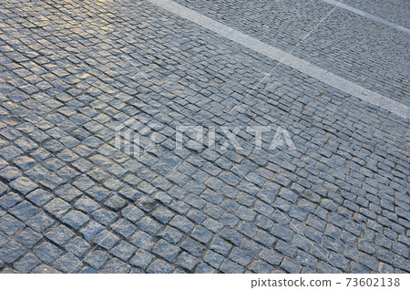 paving stones on automobile road paving stones on automobile road 73602138