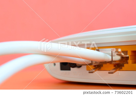 The Internet cable plugs are connected to the Internet router, which lies on a bright orange background. Items required for Internet connection 73602201