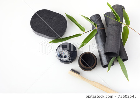 Bamboo charcoal eco friendly cosmetics products. Toothbrush and soap with skin cleansing 73602543