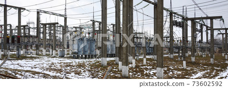 Power plant is a station of transformation. A lot of cables, poles and wires, transformers. Electro-energy. 73602592