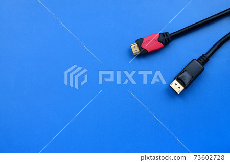Audio video HDMI computer cable plug and 20-pin male DisplayPort gold plated connector for a flawless connection on a blue background 73602728