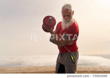Senior man doing sport exercises Senior man doing sport exercises 73603080