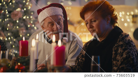 Senior couple during family dinner on Christmas 73603519