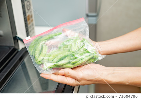 Thaw in a frozen snap pea microwave 73604796