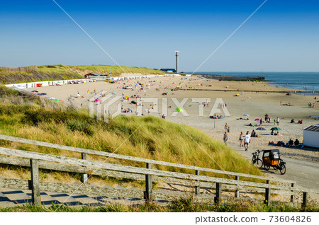 Westkapelle, The Netherlands, August 2019. The beaches of this location are wide and clean Westkapelle, The Netherlands, August 2019. The beaches of this location are wide and clean 73604826