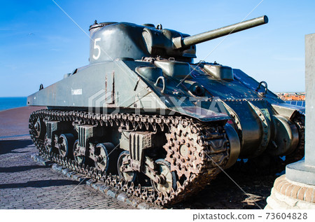 Westkapelle,Netherlands,August 2019. A tank,remnant of the Second World War,serves as a memorial along the road that surmounts the artificial hill that protects the town from the sea. Westkapelle,Netherlands,August 2019. A tank,remnant of the Second World War,serves as a memorial along the road that surmounts the artificial hill that protects the town from the sea. 73604828