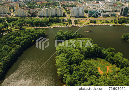 Top view of the victory Park in Minsk and the Svisloch river.A bird's-eye view of the city of Minsk and the Park complex.Belarus Top view of the victory Park in Minsk and the Svisloch river.A bird's-eye view of the city of Minsk and the Park complex.Belarus 73605051