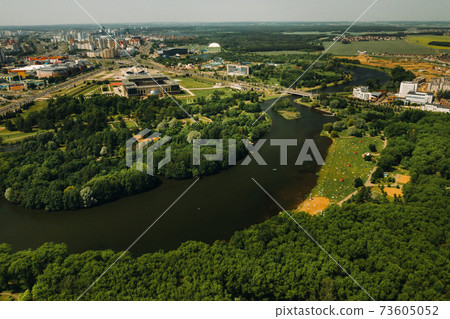 Top view of the victory Park in Minsk and the Svisloch river.A bird's-eye view of the city of Minsk and the Park complex.Belarus Top view of the victory Park in Minsk and the Svisloch river.A bird's-eye view of the city of Minsk and the Park complex.Belarus 73605052