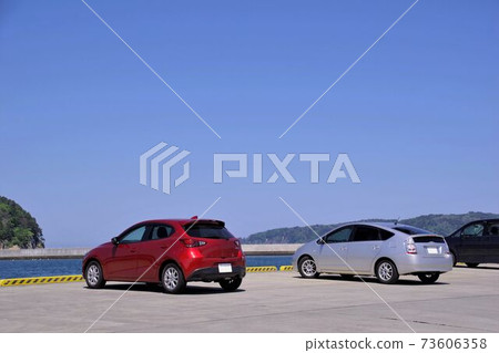 Drive image: A car parked on the quay of the port Drive image: A car parked on the quay of the port 73606358
