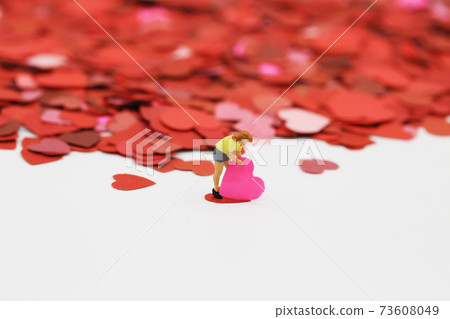 woman pick up her own heart woman pick up her own heart 73608049