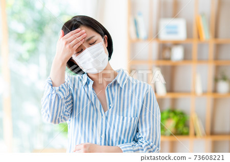 Young lady in mask shape Young lady in mask shape 73608221