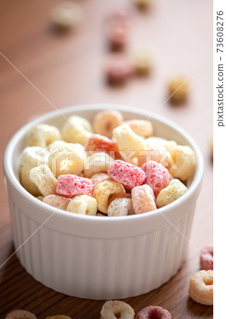 Cereal flakes in bowl ceramic with copy space,Breakfast concept.Food with delicious fruity taste and fruity colours.It's made with maize,wheat,and barley. 73608276