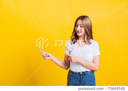 woman teen standing wear t-shirt pointing finger away side woman teen standing wear t-shirt pointing finger away side 73608588
