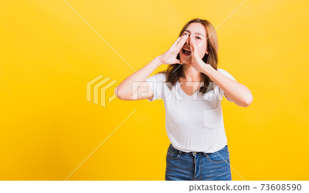 woman teen standing big shout out with hands next mouth giving excited positive woman teen standing big shout out with hands next mouth giving excited positive 73608590