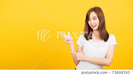woman teen standing wear t-shirt pointing finger away side woman teen standing wear t-shirt pointing finger away side 73608593