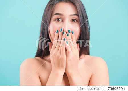 woman standing smiling surprised excited her covering mouth with hands woman standing smiling surprised excited her covering mouth with hands 73608594