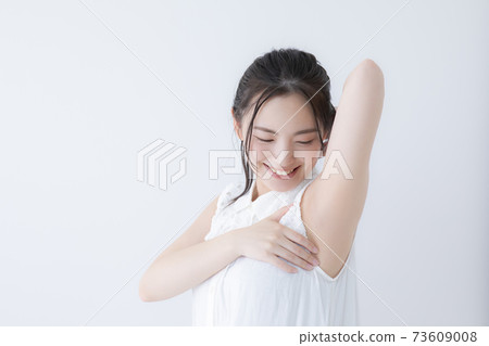 Woman waking up stretching 73609008