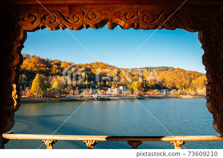 Panoramic view of Nakdong river and autumn mountain from Woryeonggyo Bridge in Andong, Korea 73609210