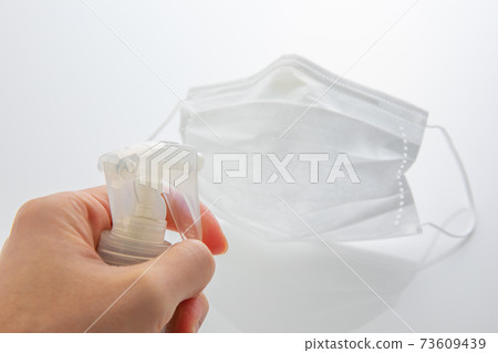 Spray on mask and focus on hand 73609439