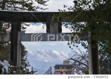 Uesugi Shrine in winter, mountain range of torii and Kuriko, Yonezawa City, Yamagata Prefecture 73609452