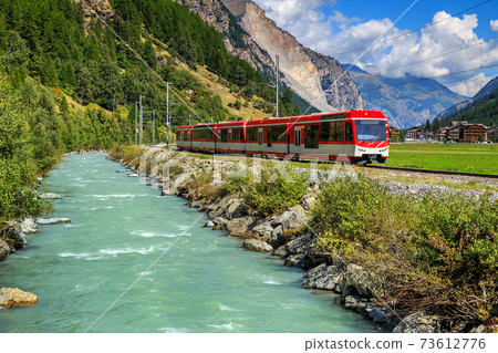 Electric red tourist train in Switzerland,Europe Electric red tourist train in Switzerland,Europe 73612776