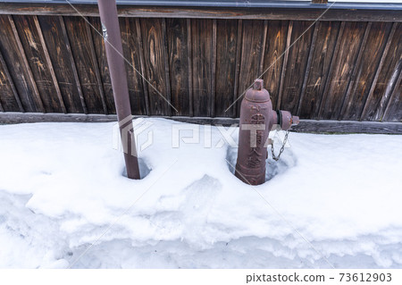 Fire hydrant buried in snow Yonezawa City, Yamagata Prefecture 73612903