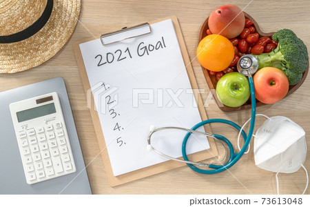 2021 New Year Goals in new normal lifestyle, work-life balance with face mask safety from covid-19, healthy food, cholesterol diet, good heart health, blank resolution list on white paper medical note 2021 New Year Goals in new normal lifestyle, work-life balance with face mask safety from covid-19, healthy food, cholesterol diet, good heart health, blank resolution list on white paper medical note 73613048
