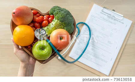 Nutritional food for heart health wellness by cholesterol diet and healthy nutrition eating with clean fruits and vegetables in heart dish by nutritionist and doctor recommended for patient well-being 73613058