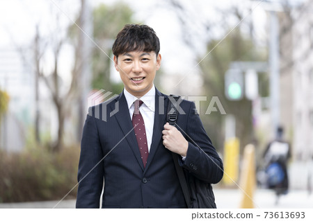 A smiling businessman in his late 30s A smiling businessman in his late 30s 73613693
