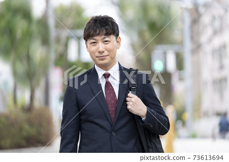 smiling businessman smiling businessman 73613694