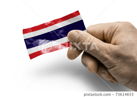Hand holding a card with a national flag the Thailand 73614655