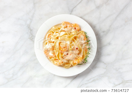 Seafood pasta. Pappardelle with shrimps and cream sauce Seafood pasta. Pappardelle with shrimps and cream sauce 73614727