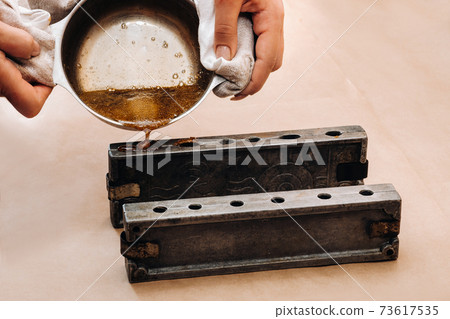 Making sugar lollipops at home.A taste of our childhood.Cockerel lollipops on a stick.Sugar caramel Making sugar lollipops at home.A taste of our childhood.Cockerel lollipops on a stick.Sugar caramel 73617535