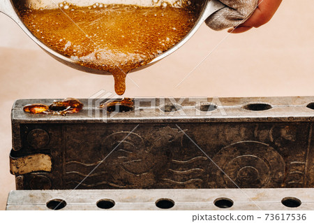 Making sugar lollipops at home.A taste of our childhood.Cockerel lollipops on a stick.Sugar caramel 73617536