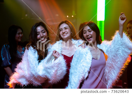 Group of women friend having fun at party in dancing club 73620643