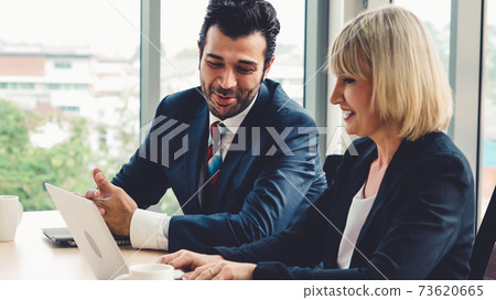 Two business people talk project strategy at office 73620665