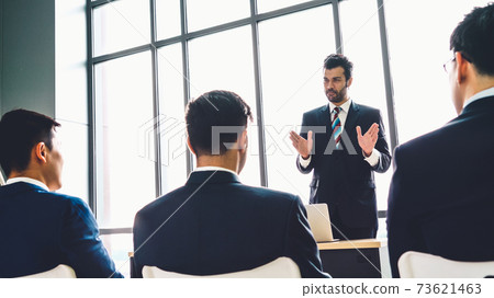 Group of business people meeting in a seminar conference 73621463