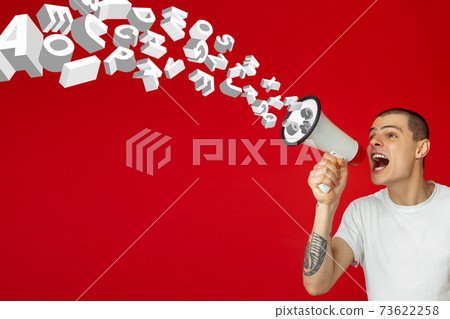 Man shouting with megaphone, loudspeaker on studio background. Sales, offer, business, cheering fun concept. 73622258
