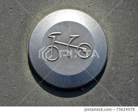 Bicycle pictogram on a bicycle track. Traffic, object. 73624079