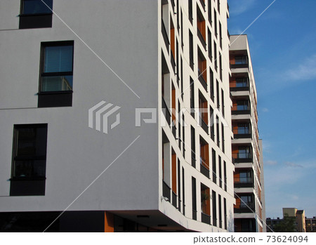 Modern apartment building. Facade, contemporary architecture. Stylish living block of flats. 73624094