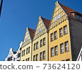 Facade of old residential house, windows., sky sunny day. Gdansk, Poland. 73624120