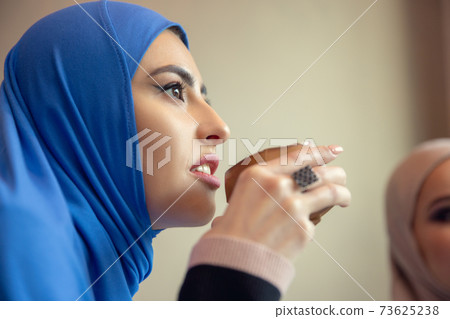 Beautiful arab women meeting at cafe or restaurant, friends or business meeting 73625238