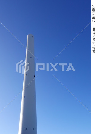 A huge white chimney towering against the blue sky (vertical composition) 3637 A huge white chimney towering against the blue sky (vertical composition) 3637 73626004