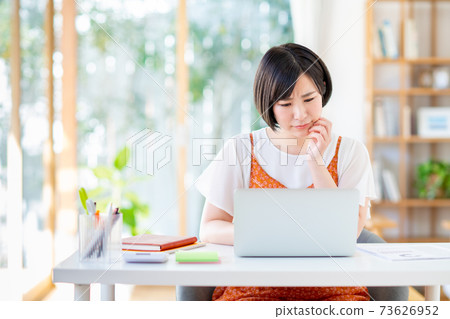 A young woman suffering from telework 73626952