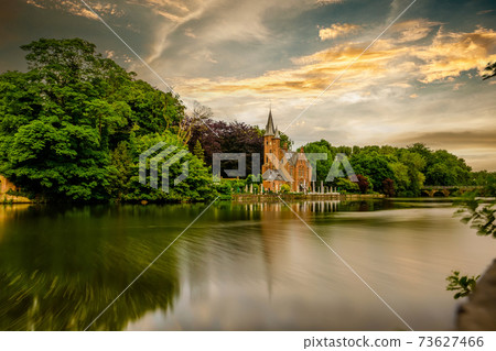 Bruges (Brugge) cityscape with Minnewater lake 73627466