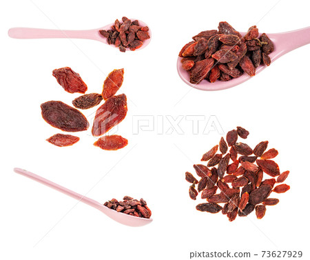 dry goji berries (wolfberry) in piles and spoons dry goji berries (wolfberry) in piles and spoons 73627929