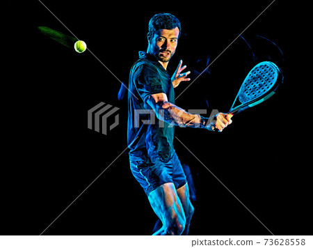 Paddle tennis player man light painting isolated black background 73628558