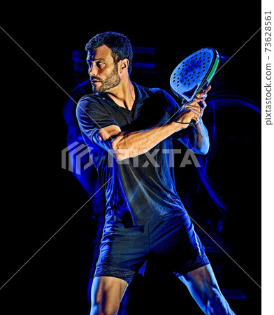 Paddle tennis player man light painting isolated black background Paddle tennis player man light painting isolated black background 73628561