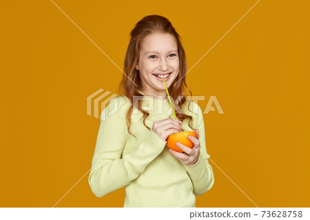 cute little child girl holding fresh juicy grapefruit cute little child girl holding fresh juicy grapefruit 73628758